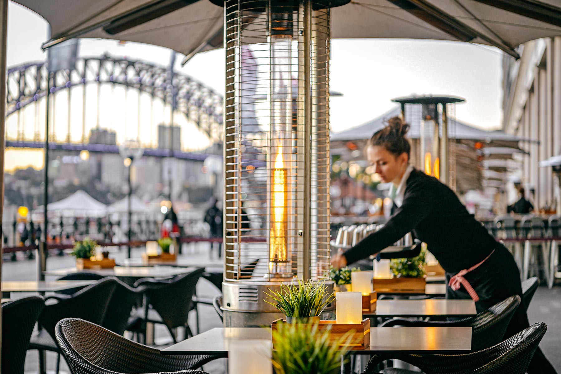 Eastbank Cafe Restaurant – waitress setting table on Circular Quay promenade